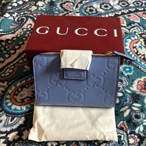 Gucci Periwinkle GG Embossed Zip Wallet